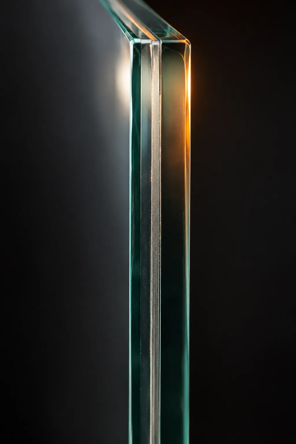 Edge of a laminated fire-rated glass unit, two panes with a clear interlayer